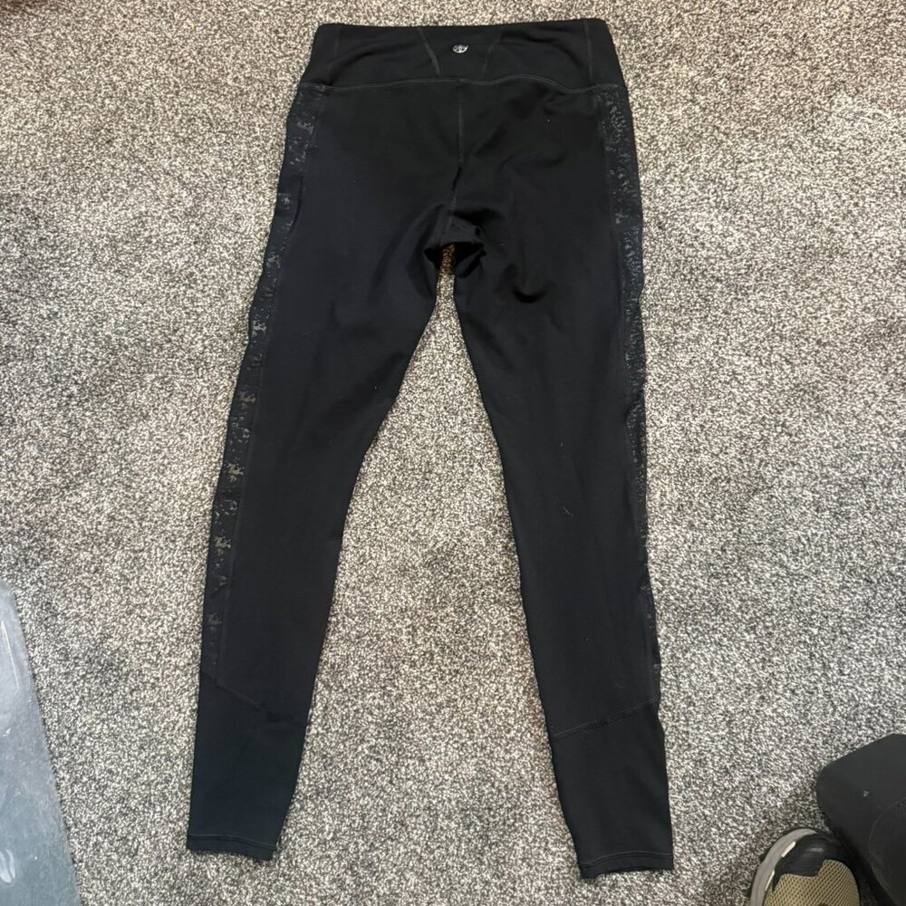 Gaiam black leggings with accent stripe up sides, size medium